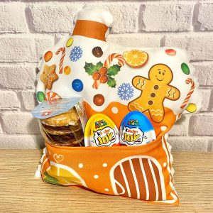 Ingwerlebkuchenhaus-Kissen mit einer Tasche für Süßigkeiten