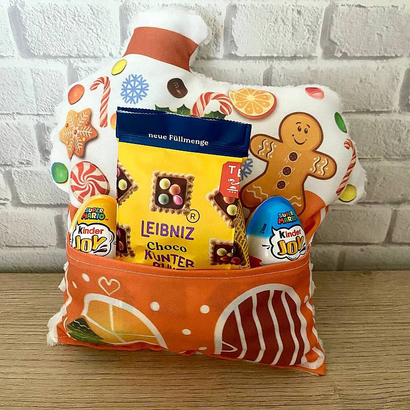 Ingwerlebkuchenhaus-Kissen mit einer Tasche für Süßigkeiten