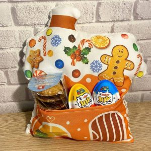 Ingwerlebkuchenhaus-Kissen mit einer Tasche für Süßigkeiten